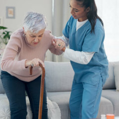 Caregiver support, elderly woman with walking stick