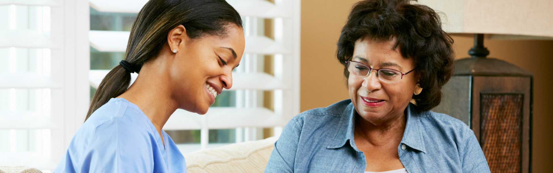 carer talking to senior woman